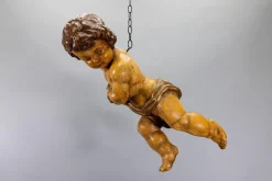 Deutsche Puttenfigur aus geschnitztem Holz im barocken Stil