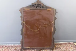 Dunkelbrauner Wandspiegel aus geschnitztem Holz im Rokoko-Stil